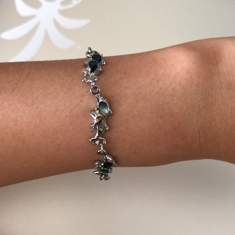 Silver tone multicolored dolphin link bracelet